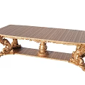 Luxurious Golden Dining Table With Ornate Carved Legs And Intricate Details