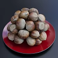 Red Plate Decoration With Pile of Fresh Chestnuts on Dark Background