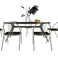 Modern Dining Table Set with Four Chairs Vase Dried Plants and Fruit Plate