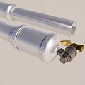 Two Silver Cylindrical Industrial Components With Golden Connecting Parts For Mechanical Applications