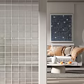 Modern Grid Pattern Room Divider Separating Living Space With Sofa Pillows And Wall Art