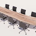 Long Wooden Conference Table With Black Wheeled Office Chairs In Modern Office