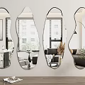 Four Irregular Shaped Wall Mounted Mirrors Reflecting Modern Interior Decor