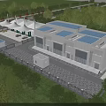Modern Industrial Factory Building Featuring Blue Roof Surrounding Greenery And Parking Area