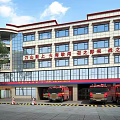 Modern Fire Station Building with Fire Truck Trees and Safety Stripes