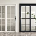 Stylish White and Black Sliding Doors with Glass Panels and Indoor Plant View