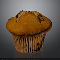 Golden Fluffy Muffin With Chocolate Chips In Paper Liner On Dark Background