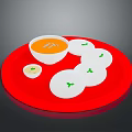 Appetizing Orange Soup With White Steamed Rice Cakes And Green Garnish On Red Plate