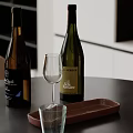 Modern Kitchen Countertop With Wine Bottles Wine Glass And Wooden Tray