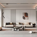 Modern Living Room Interior With Beige Sofa Pillows Round Coffee Table Decorative Painting And Green Plant