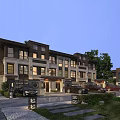 Modern Townhouse Exterior Design With Landscaping Driveway And Evening Lights