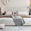 Modern Double Bed With Upholstered Headboard Pillows Checkered Blanket And Cat Ornament
