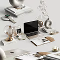 Organized Desktop Setup With Stacked Magazines Smartwatch Globe Laptop Photo Frame And Decorative Candles