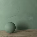 Light Green Sphere Decorative Component On Wooden Surface With Textured Wall