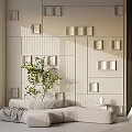 Beige Modern Irregular Shaped Sofa In Minimalist Interior With Geometric Wall Design And Potted Plant