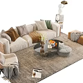 Modern Beige Sofa With Colorful Pillows Round Coffee Table Ottoman And Magazines On Area Rug
