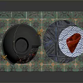 Black Stove With Green Plaid Mat Brown Gloves Blue Table White Plate And Red Food