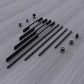 Long Black Metal Cabinet Handles With Small Mounting Screws On Gray Surface
