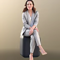Elegant Woman in Gray Suit Set Sitting on Black Cube with Light Brown Background
