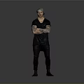 Tattooed Man Wearing Black T Shirt And Pants With Arms Crossed Against Gray Background