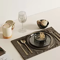 Modern Dining Table Setting With White Mug Wine Glass Black Bowl Bread Rolls And Cutlery