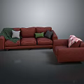 Red Sofa And Armchair With Colorful Cushions And Patterned Blankets