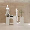 Modern White Display Shelf with Mannequin in Dress Folded Towels Sunglasses and Plant