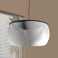White Wavy Texture Pendant Light Hanging In Indoor Space With Window Blinds And Beige Wall
