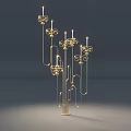 Golden Metal Candle Holders With Multiple Arms And Floral Decorations In Dark Background