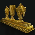 Golden Decorative Ornament Set With Harp Shaped Centerpiece Spiral Tassel Side Pieces On Wavy Base