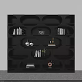 Modern Black Bookcase With Multiple Compartments Storing Books Decorative Items And Potted Plant