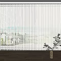 White Vertical Blinds With Ocean View And Indoor Plant Decoration