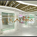 Modern Green Clothing Store Interior With Mannequins Racks And Green Plants