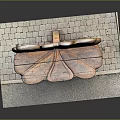Artistic Leaf Shaped Sculpture Seat With Wooden Texture And Brick Base On Stone Platform