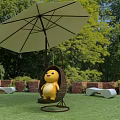 Yellow Inflatable Cartoon Figure Sitting On Hanging Rattan Swing Under Umbrella In Garden