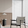 Modern Bedroom with Beige Walls Wooden Flooring Minimalist Design Pendant Light Nightstand and Armchair