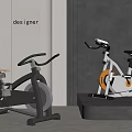 Modern Stationary Bikes As Sports Equipment With Gray White Frames Yellow Flywheel