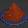 Red Pyramid Shaped Object Placed On Blue Circular Plate With Patterns