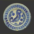 Antique Ceramic Plate Featuring Carved Bird Motif And Blue White Decorative Rim