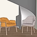 Modern Spiral Staircase With Black Metal Structure Orange Leather And Gray Fabric Chairs Wooden Floor