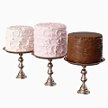 Three Beautiful Cakes With Unique Textured Frostings On Silver Stands