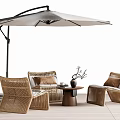 Outdoor Wicker Table and Chair Set With Umbrella Cushions and Decorative Accents