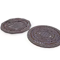 Two Brown Ornate Coasters With Intricate Carved Circular And Polygonal Patterns