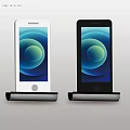 White And Black Smartphones On Charging Stands With Circular Gradient Screens