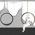 Round Indoor Hanging Chair With Green Plant Wall And Woman Sitting Comfortably