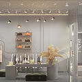Stylish Clothing Store Interior With Clothes On Racks Bags On Shelves And Decorative Dried Flowers