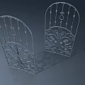 Ornate Metal Swing Doors With Intricate Floral Patterns And Arched Design