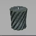 Green Twisted Pattern Candle With White Wick On Dark Background Reflection Surface