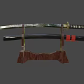 Traditional Japanese Katana on Wooden Display Stand with Red String Handle Wrapping and Black Scabbard Golden Emblem