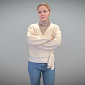 Woman Standing With Crossed Arms In Beige Sweater And Blue Jeans Against Grey Background